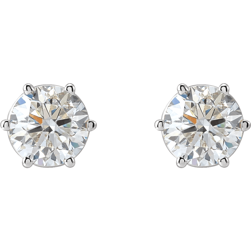 Pair of diamond stud earrings on a white background