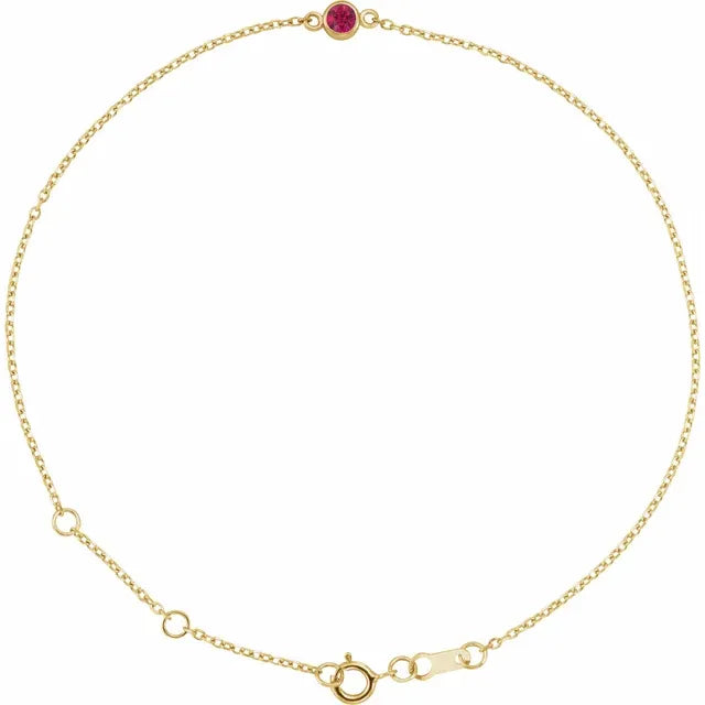 Gold bracelet with a red ruby